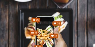 Taking food photograph by mobile smart phone, and sharing on social media, social network with notification icons